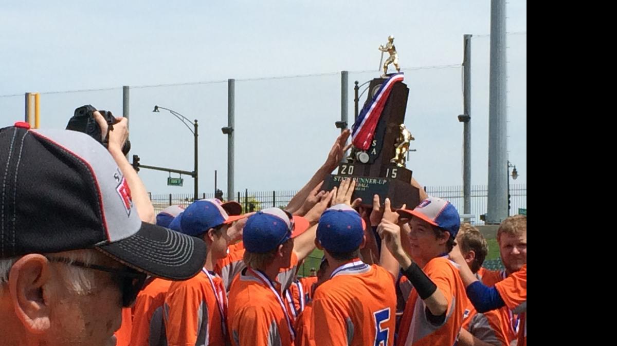
Okawville Rockets players hoist the second-place trophy following their championship game loss to Cobden on Saturday in Peoria.
