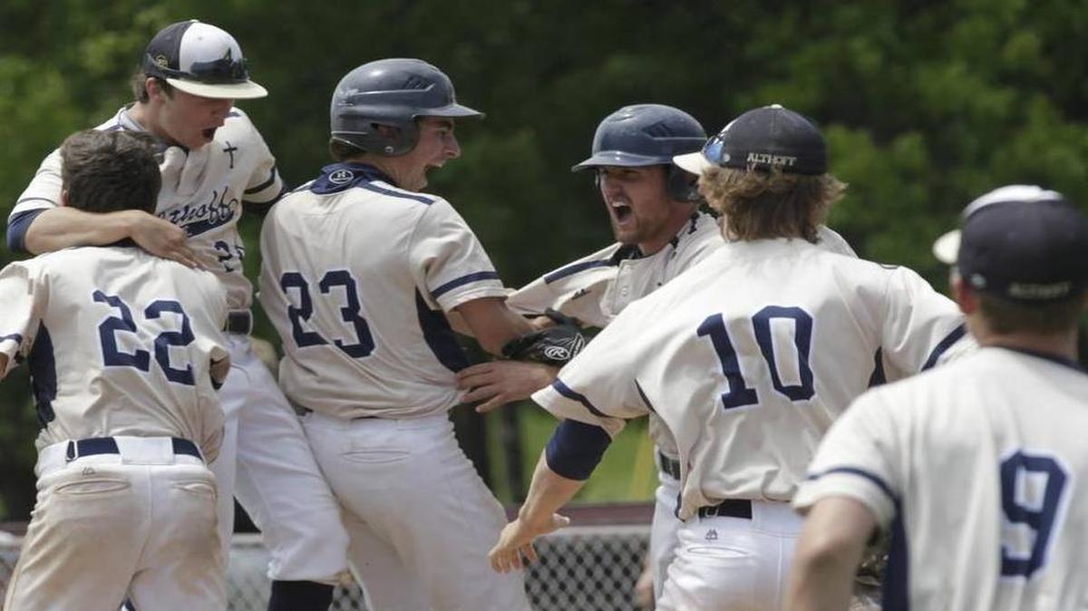 
Althoff players celebrate their playoff win over Wesclin on Saturday.
