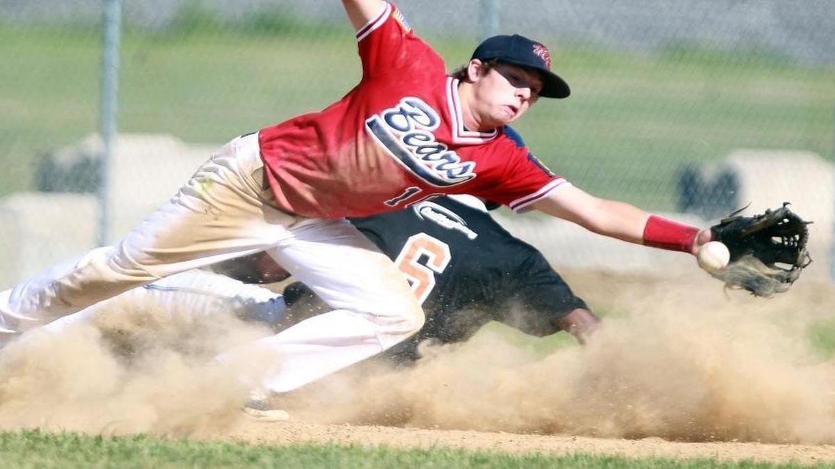 Metro-East Bears third baseman Austin Stilts stretches for the throw in a game last season. The Bears are hosting the American Legion Baseball Great Lakes Regional for the second year in a row.