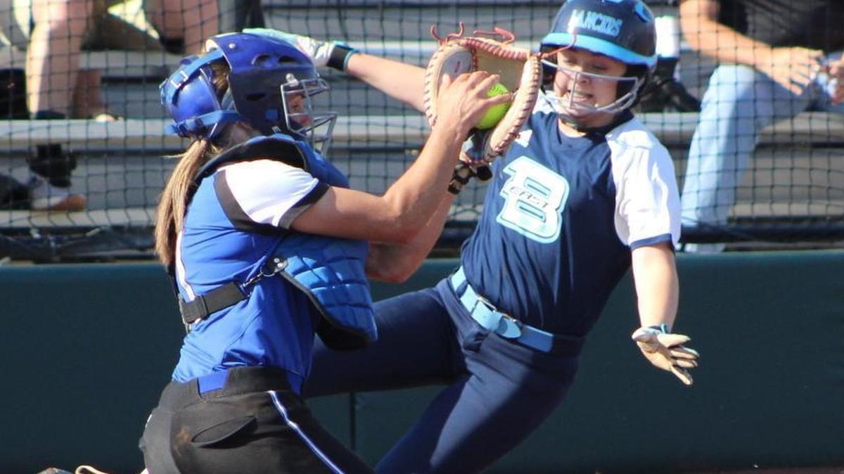 Belleville East’s Mackynzee Dalle attempts to score on a two-out base hit by Alex Boze, but was tagged out by Lincoln-Way East catcher Christine Malito in a close play at the plate to end the inning. The Lancers fell to Lincoln-Way, 6-2, in the IHSA Class 4A Super-Sectional in Normal.