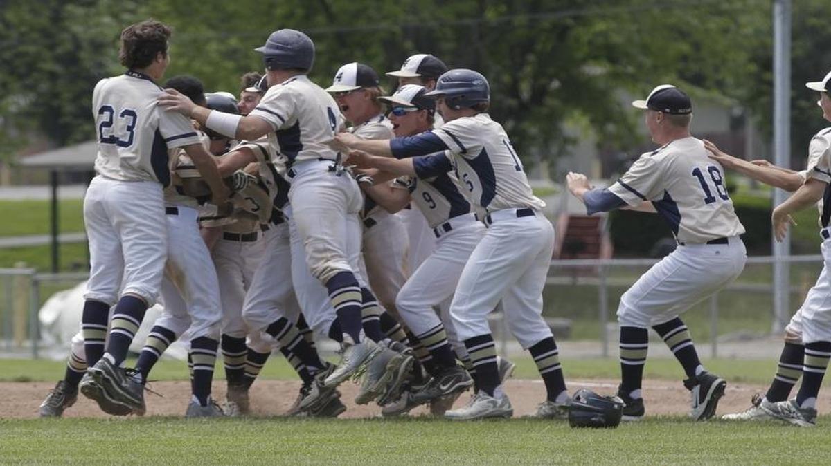 Stephen Toenjes (23) and his Althoff teammates celebrate their Class 2A regional championship last spring.