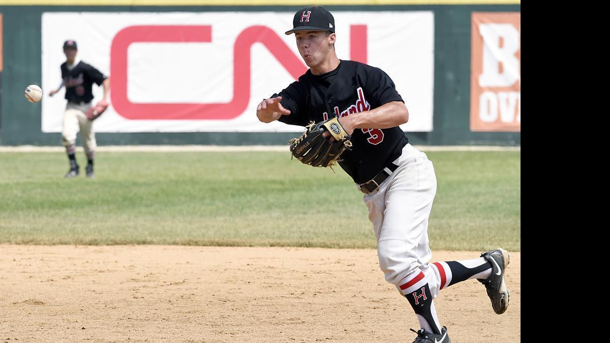 
Highland's (3) Seth Luitjohan 2nd baseman fields the ground ball for the out at 1st base against LaGrange Park (Nazareth Academy) and Highland won 7-6 at the IHSA 3A State Championship game held at Silver Cross Field, Joliet, IL. on Saturday,June 13, 2015. | Larry W. Kane for Belleville News-Democrat Media 
