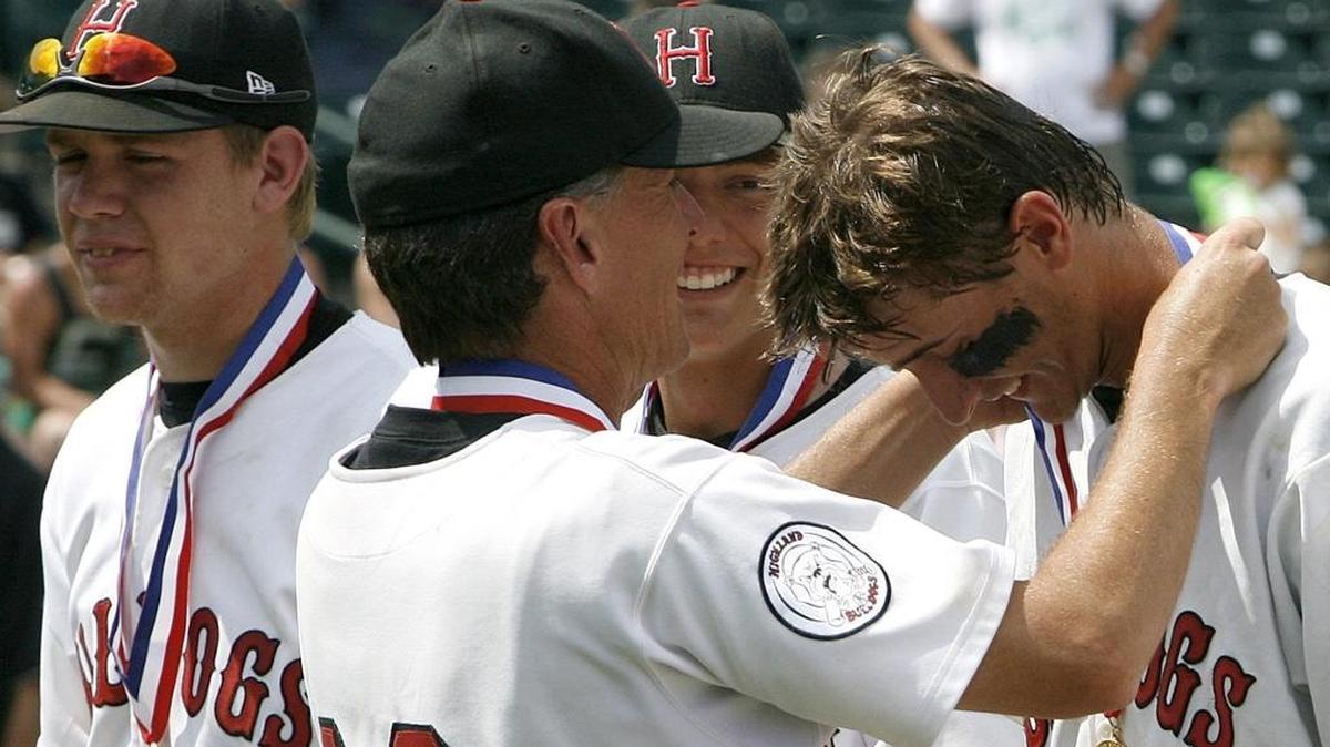 Former Highland pitcher and current major leaguer Jake Odorizzi gets his 2008 state championship medal from Highland coach Joel Hawkins.