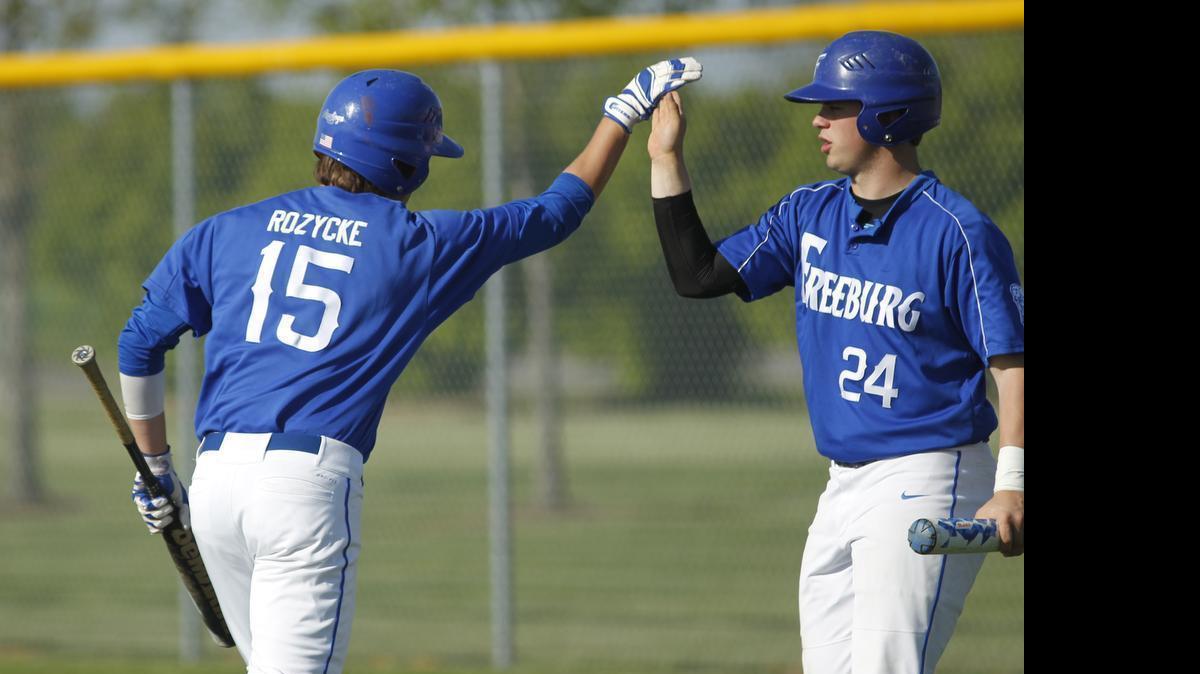 
Freeburg's Derricke Rozycke is congratulated by teammate Austin Sweet after he scores during their game against Central on Friday.
