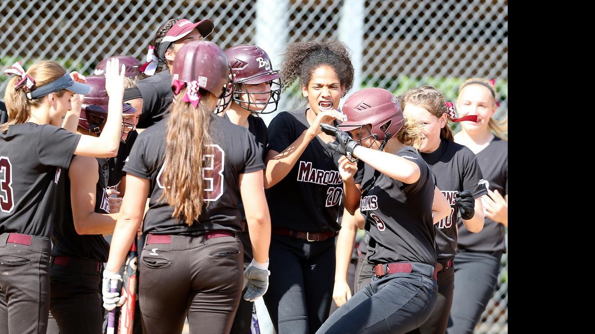 
At right, Belleville West's Olivia Young is congratulated at home after hitting a three run home run in the 1st inning against Collinsville.
