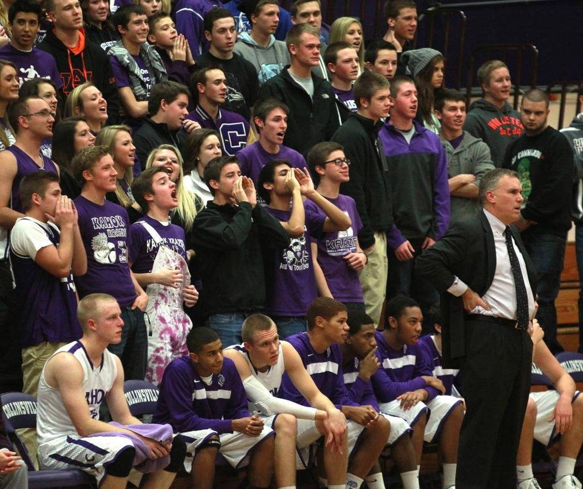 Collinsville boys basketball coach Darin Lee watches his team during the Collinsville Holiday Tournament in 2013 with backing of the Kahoks’ student section.