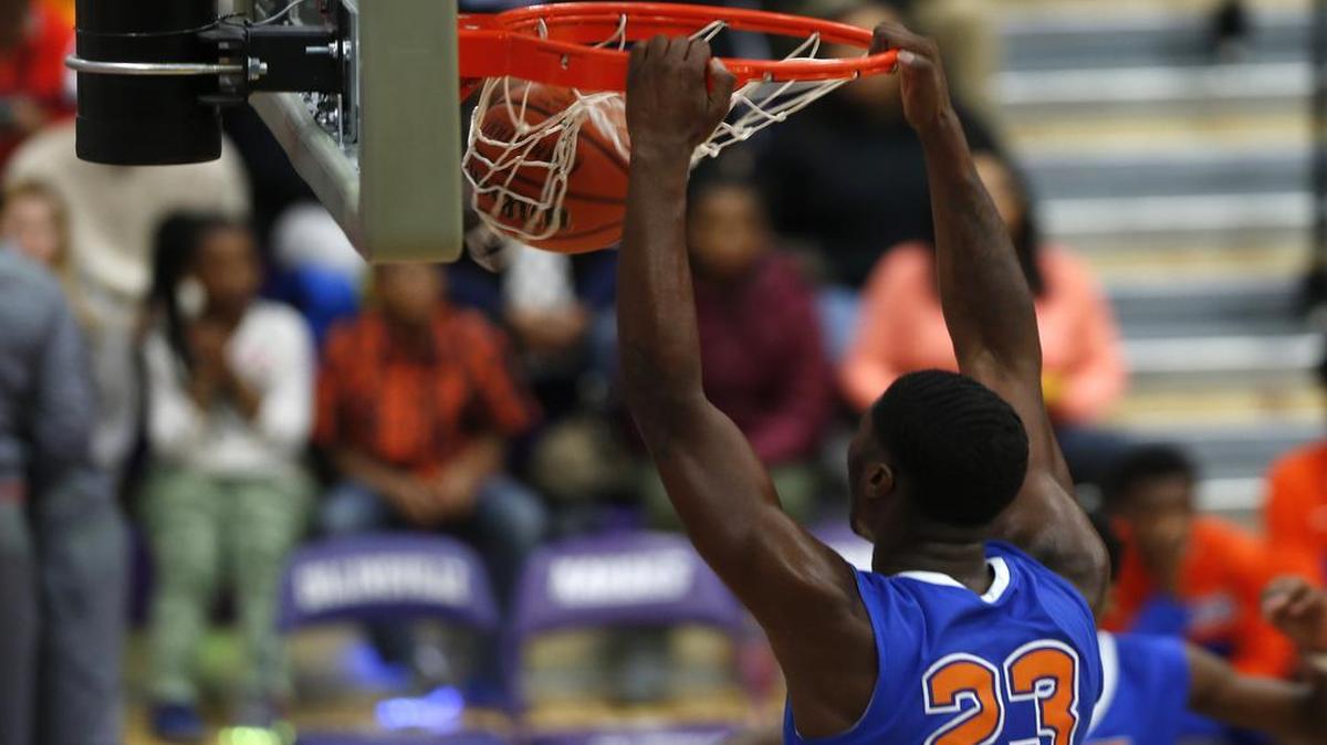 East St. Louis’ Jeremiah Tilmon dunks during their game against Springfield Southeast at the 33rd Annual Prairie Holiday Classic at Collinsville High School.