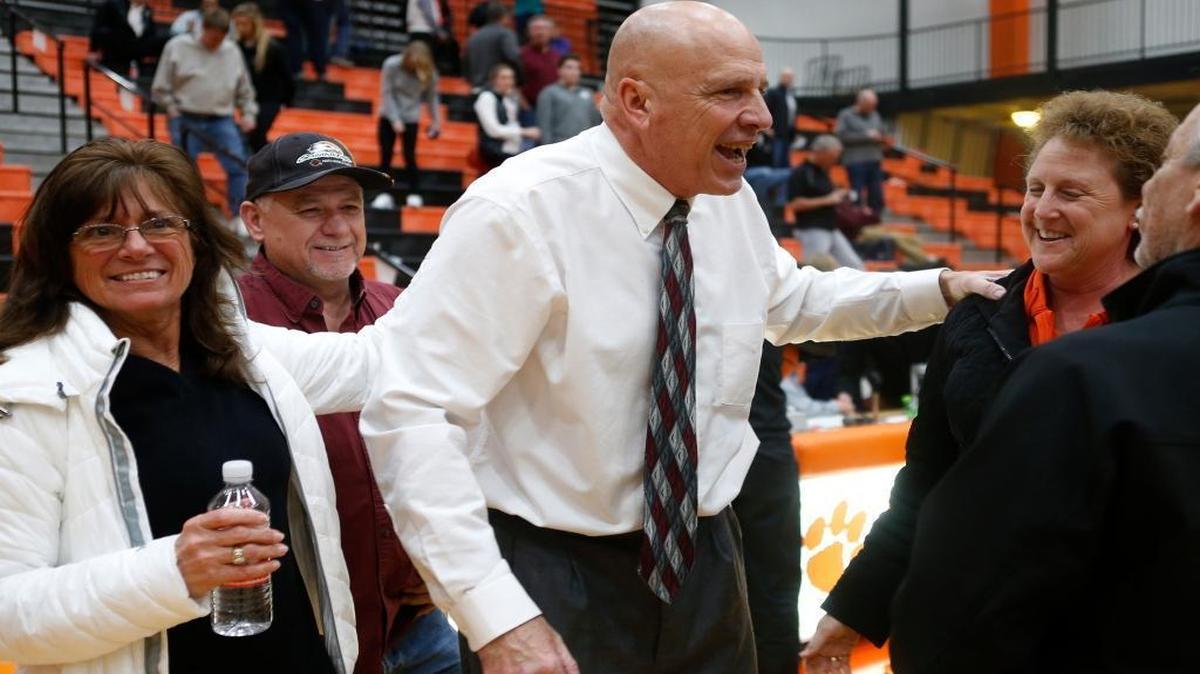 Edwardsville’s head coach Mike Waldo is congratulated by well wishers after his 700th carrer win on Tuesday at Edwardsville High School. The Tigers defeated the De Smet Spartans from St. Louis. See a gallery of photographs and a video at bnd.com.
