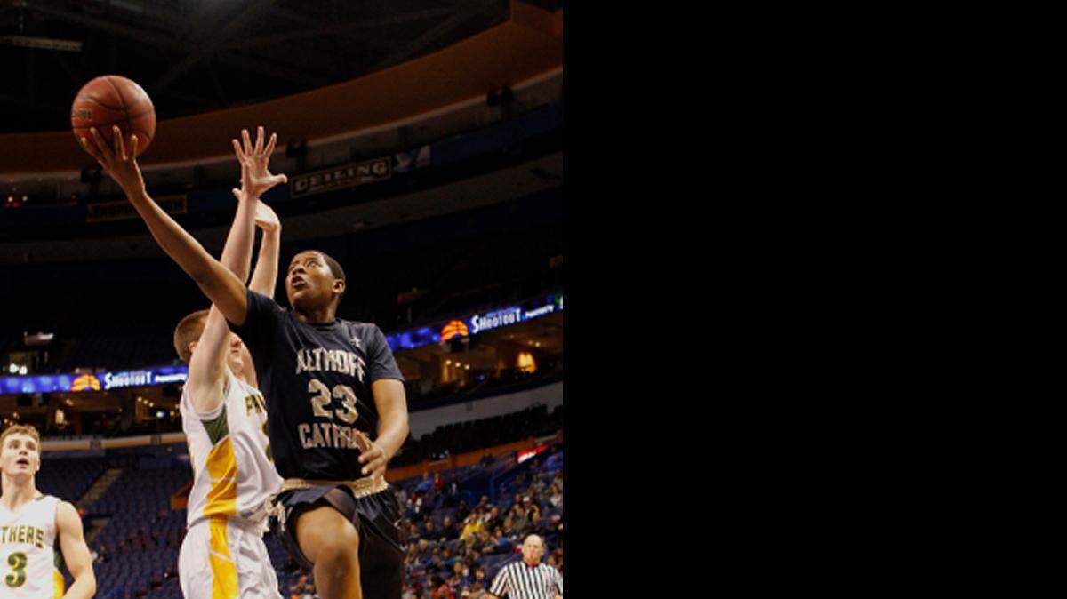 
Althoff’s Jordan Goodwin drives past Panthers' Blake Buis as he goes for a layup this season.

