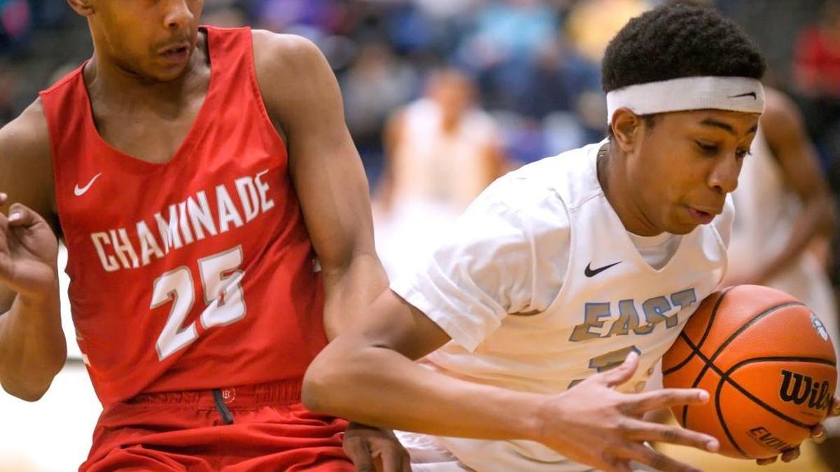 Belleville East’s Isaiah May drives against Chaminade’s Keyyaun Batchman during last year’s Chick-fil-A Classic basketball tournament at Belleville East High School.