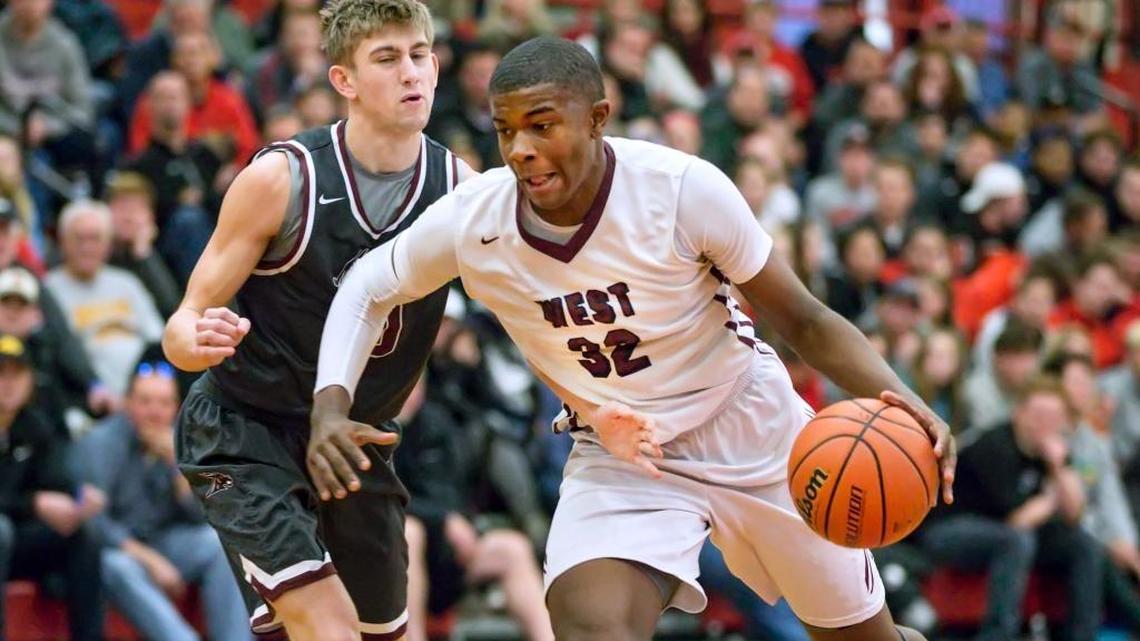 Belleville West’s EJ Liddell drives against Poplar Bluff’s Xander Martin during the 27th annual Highland Shootout at Highland High School.