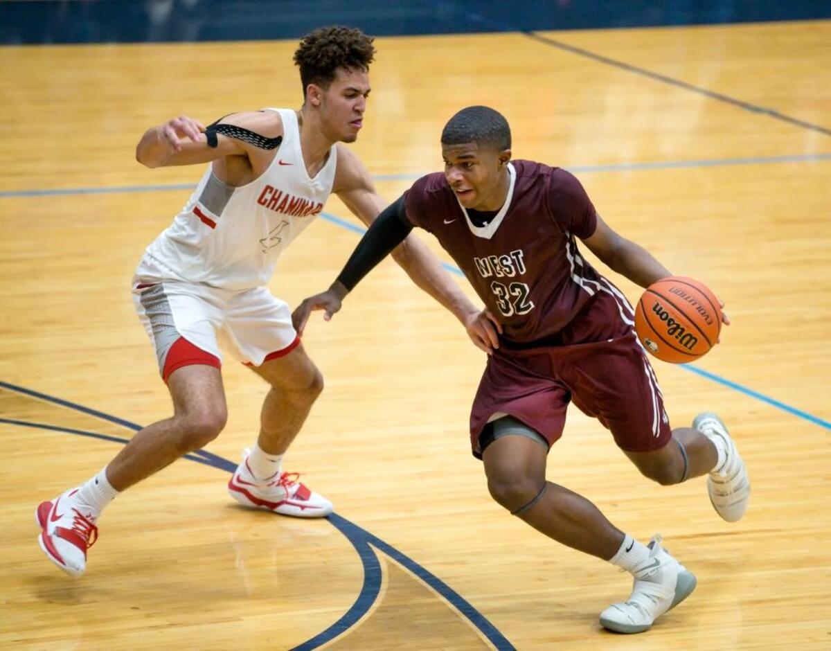 Belleville West's EJ Liddell drives to the basket against Chaminade's Jericole Hellems during the Chick-fil-A Classic basketball tournament championship game in January at Belleville East High School.