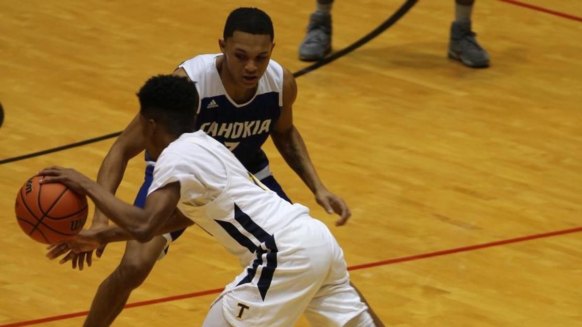 Cahokia’s Elijah Rice holds his ground as Brandon Fredrick attempts a move toward the goal in the first round of the Centralia Holiday Tournament on Thursday.