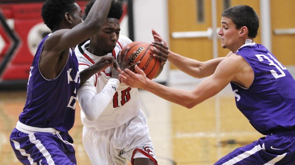Granite City’s Kenny Berry (center) is among the area scoring leaders, averaging more than 20 points per game.