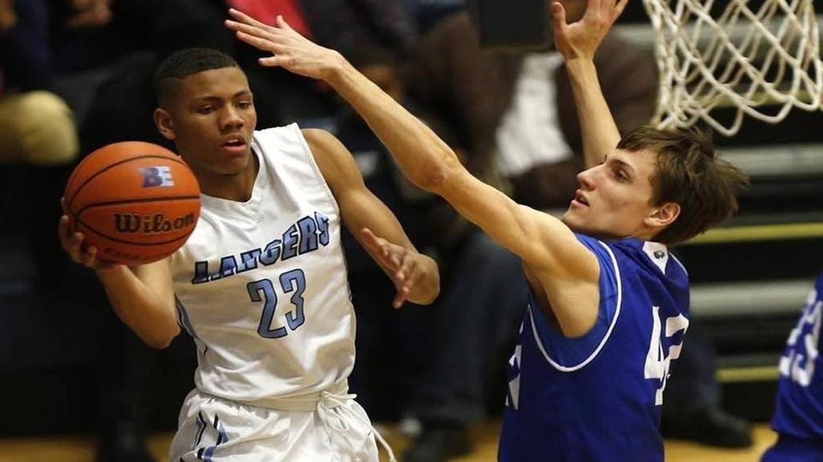 University of Illinois recruit and Belleville East senior Javon Pickett (left) will lead the Lancers against top-ranked Bolingbrook on Saturday at the Bank of O’Fallon Shootout.