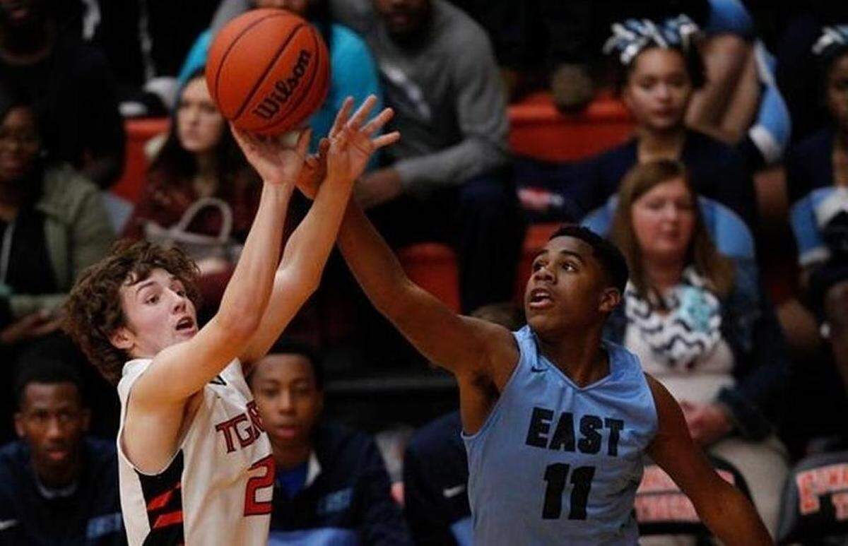 Malachi Smith (11) challenges an Edwardsville shooter during a game this past season. Smith played at Belleville East his first three years of high school but transferred to West for his senior season.