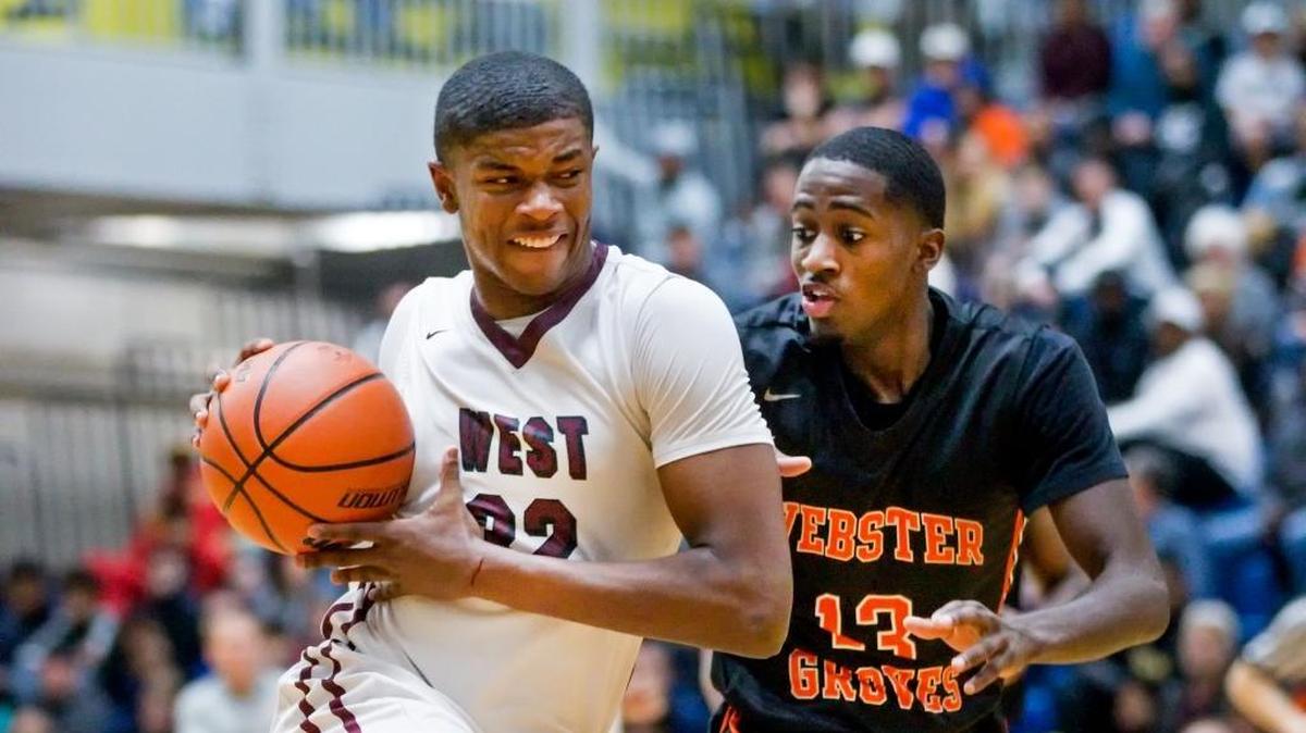 Belleville West’s EJ Liddell drives against Webster Groves’ Courtney Ramey during Saturday’s Bank of O’Fallon Shootout game at O’Fallon High School.