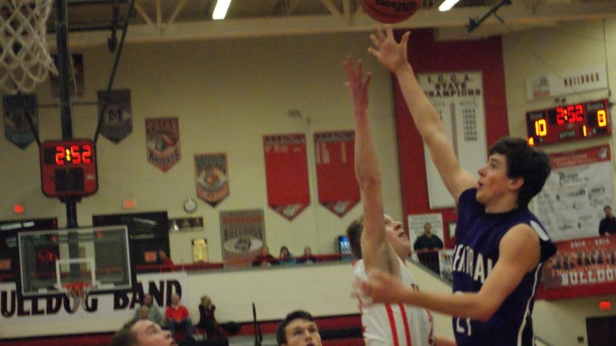 Central High senior Logan Kohrmann (right) surpassed 1,000 career points in the Cougars’ championship run at the Effingham St. Anthony Thanksgiving Tournament.