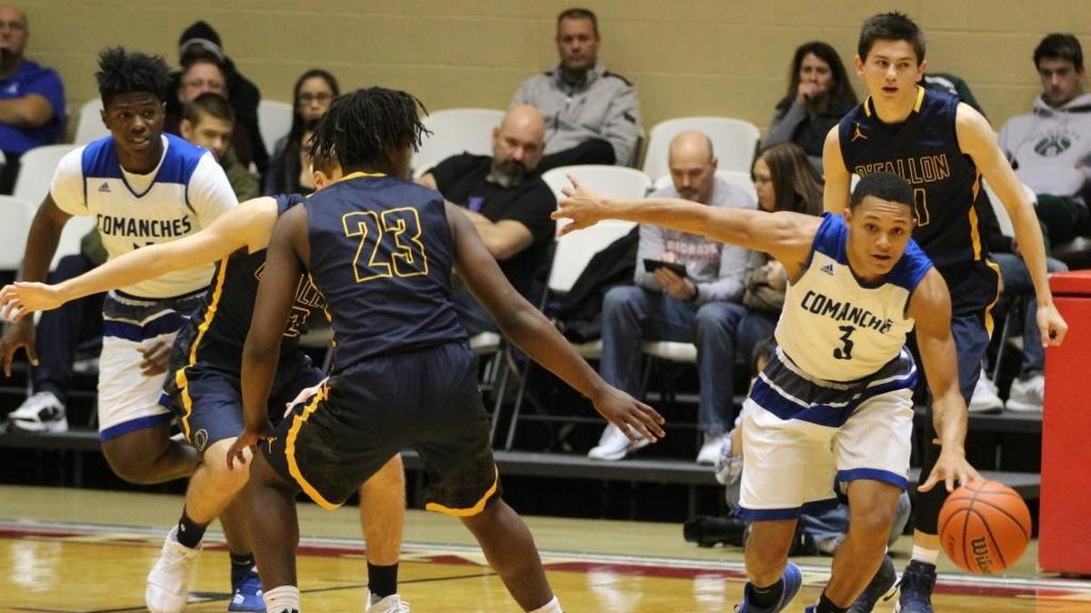 Cahokia’s Elijah Rice dribbles down court under pressure from O’Fallon senior Ronnie Anthony in the consolation championship game of the 75th Centralia Holiday Tournament Saturday.