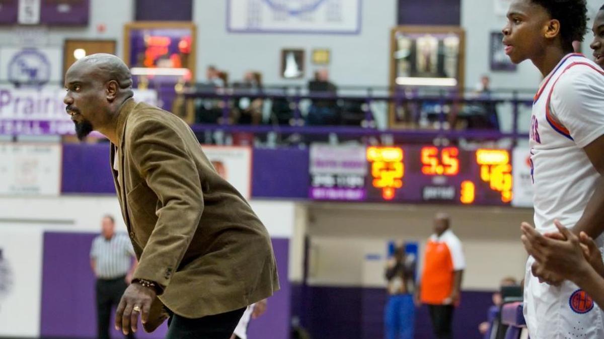 East St. Louis coach Fernando Stevenson directs his team at the Collinsville-Prairie Farms Holiday Classic basketball tournament at Collinsville High School last Thursday. Appointed interim head coach 11 days before the season began, Stevenson resigned from the job following the tournament.