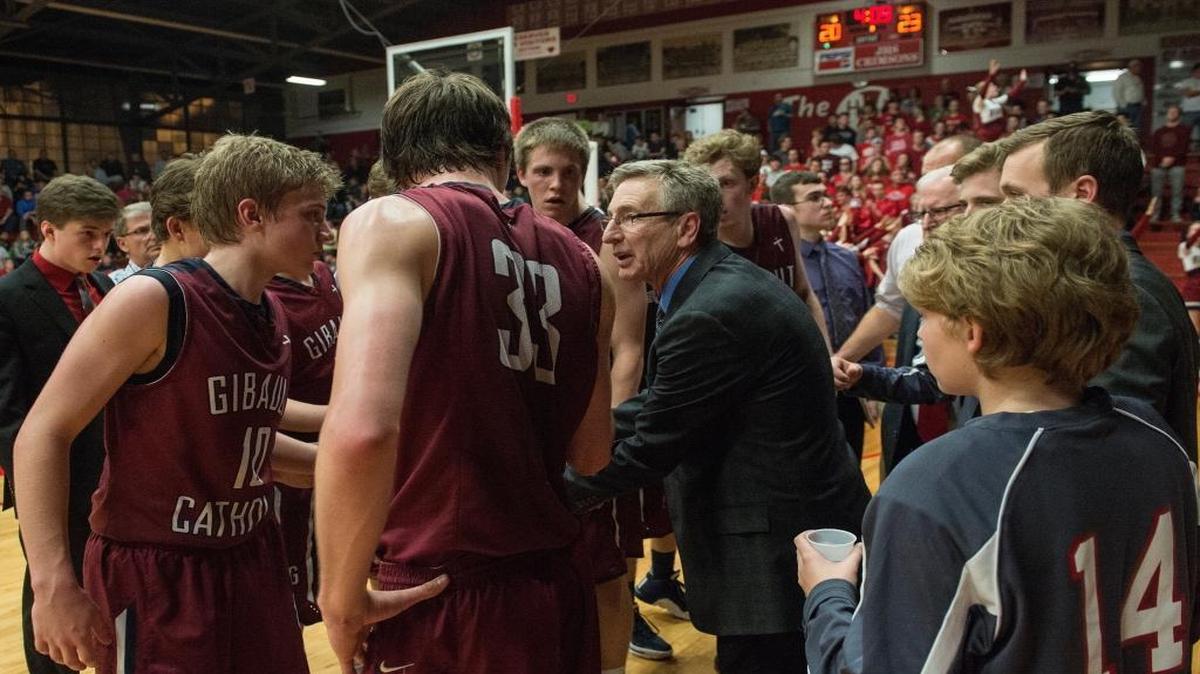 Gibault Hawks coach Dennis Rueter giving instructions to his team.