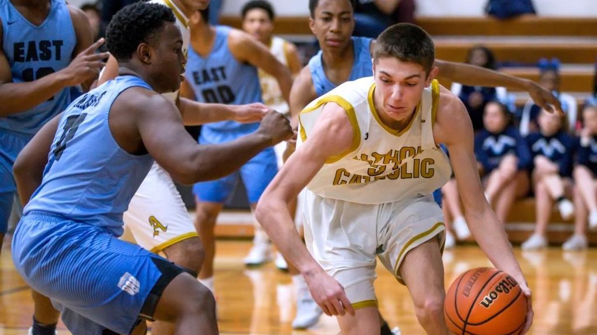 Daulton Burgner, right, in action earlier this season against Belleville East, scored nine points Thursday but Althoff fell to Alton Marquette 55-49.