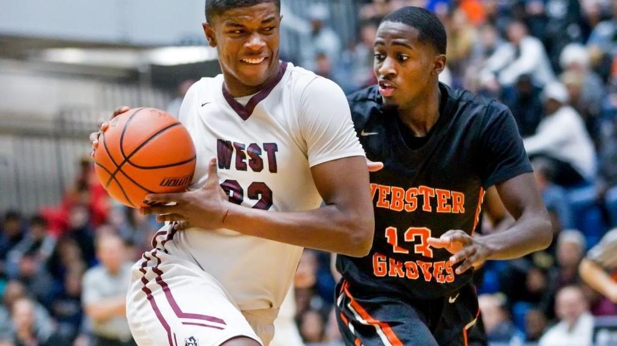 Belleville West junior EJ Liddell drives against Webster Groves senior Courtney Ramey during the fourth annual Bank Of O’Fallon Shootout on Saturday at O’Fallon High.
