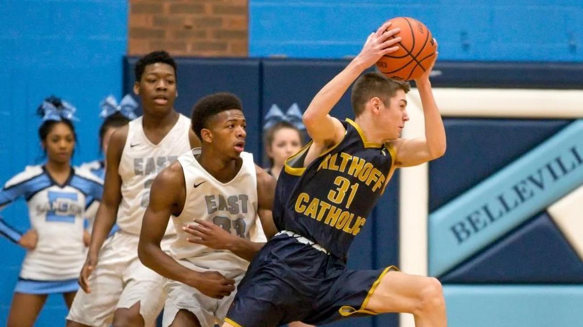 Althoff’s Daulton Burgner drives to the basket during Saturday’s Chick-fil-A Classic basketball tournament at Belleville East High School.