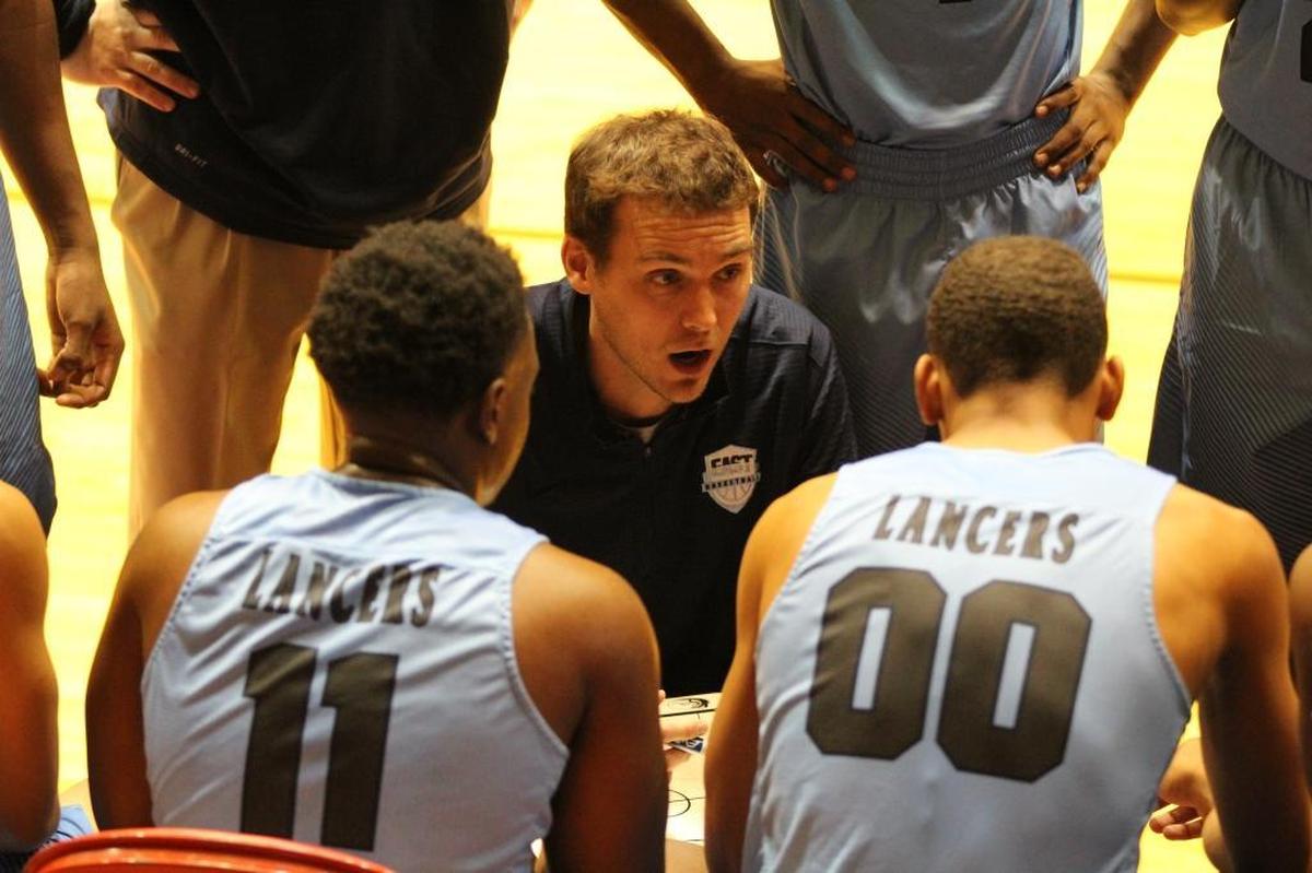 Belleville East first-year head coach Jeff Creek talks to his team during a timeout during a game last season.