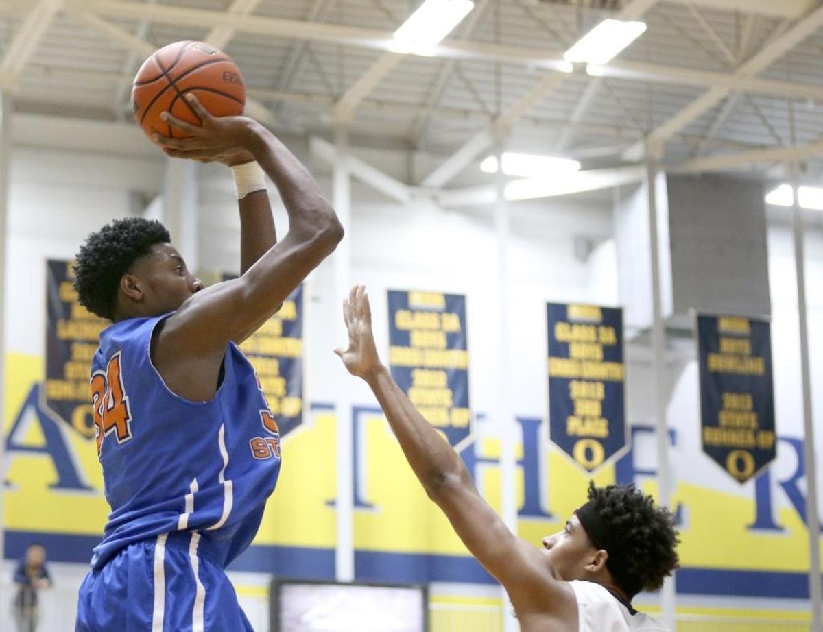East St. Louis's Terrence Hargro puts up a shot against O'Fallon defender Jarvus Smith in a game last season.