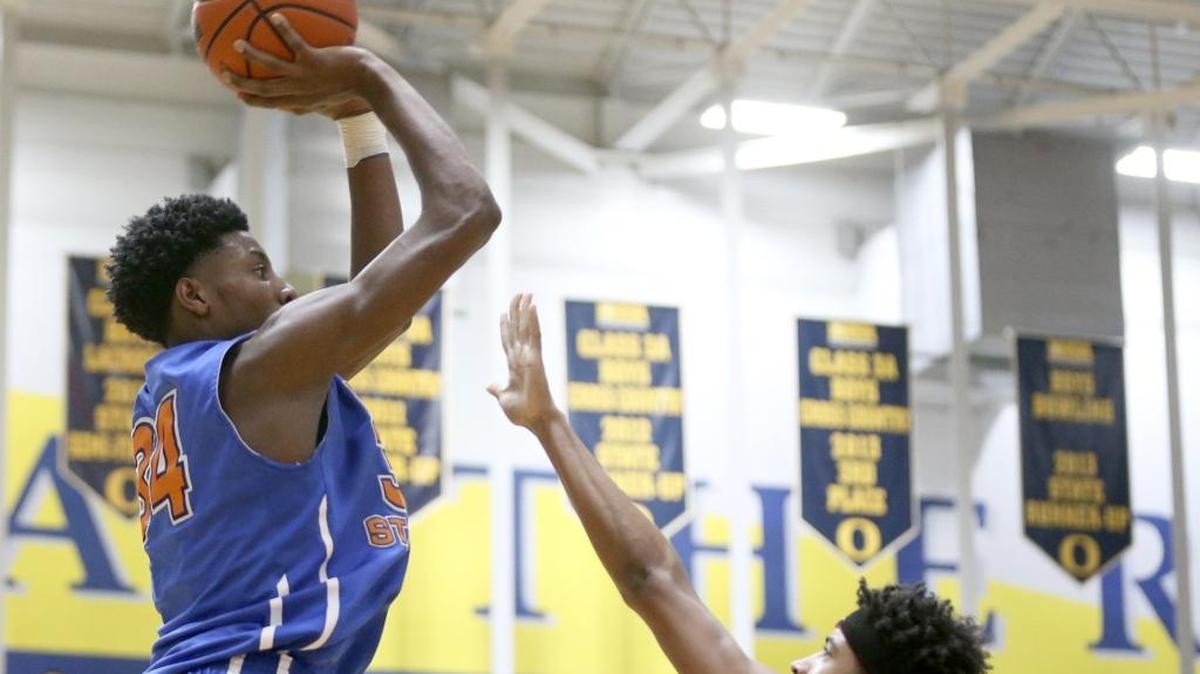 East St. Louis's Terrence Hargro puts up a shot against O'Fallon defender Jarvus Smith in a game last season.