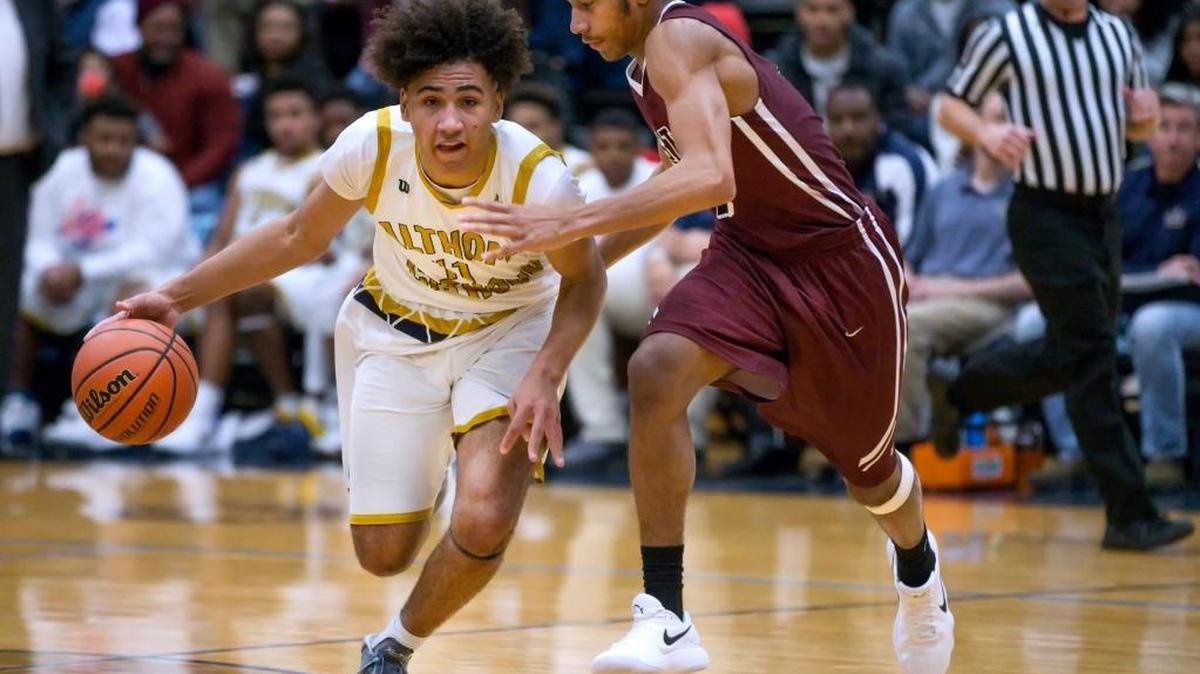 Althoff’s Greg Wells drives against Belleville West’s Curtis Williams during the Chick-fil-A Classic basketball tournament at Belleville East High School last season.