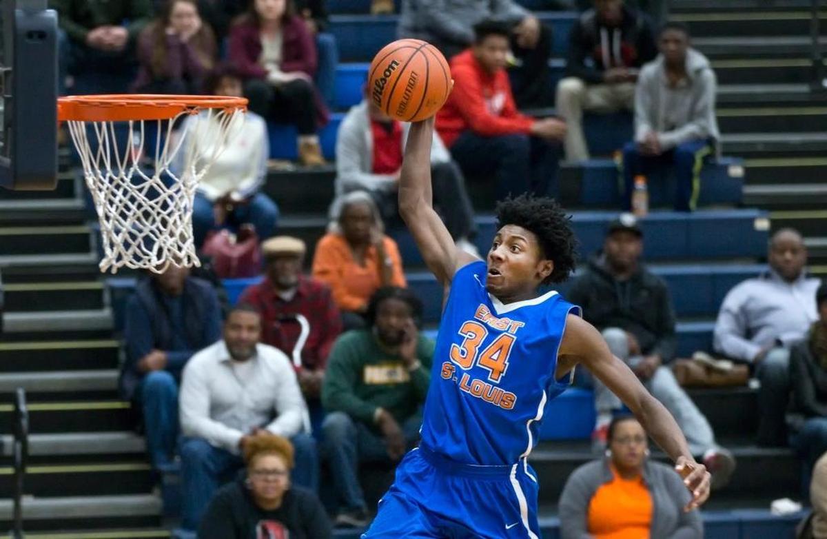 East St. Louis’ Terrance Hargrove Jr. goes up for the slam during Friday’s game at Belleville East High School.