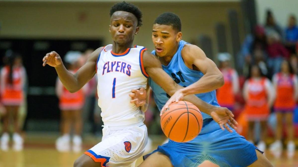 Belleville East’s Jaylen Lacey drives against East St. Louis’ Jashawn Anderson during Saturday’s SWC event at SIUE’s Vadalabene Center.