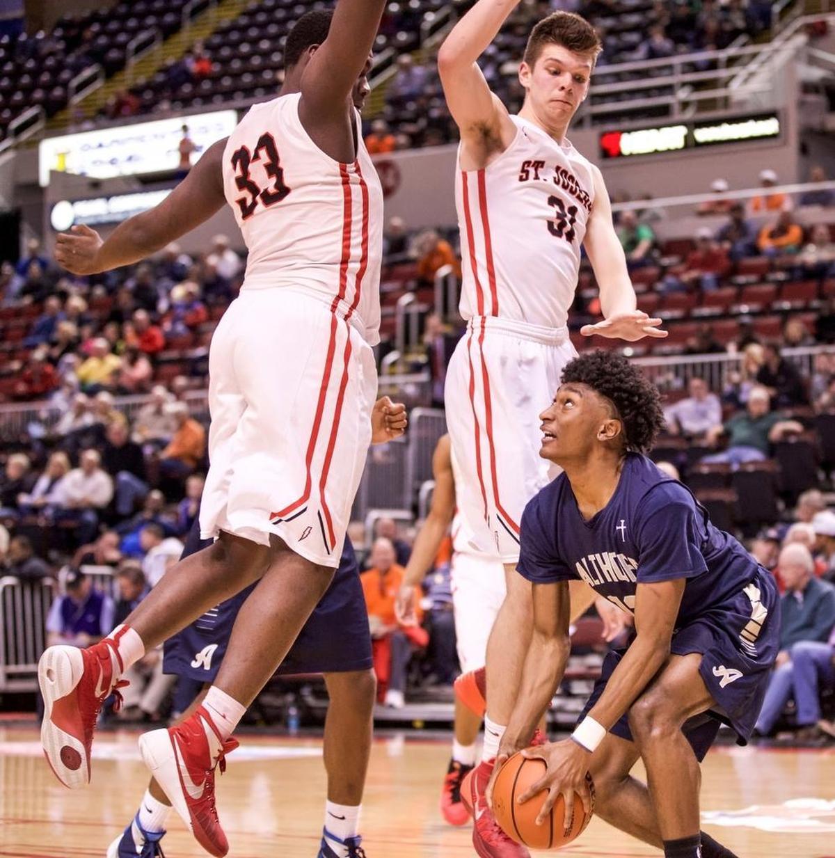 Then-Althoff guard CJ Coldon looks up at two St. Joseph defenders in 2016 at the IHSA Class 3A state tournament. Coldon enjoyed a tremendous basketball and football career for the Crusaders and now has his sights set on the NFL draft.