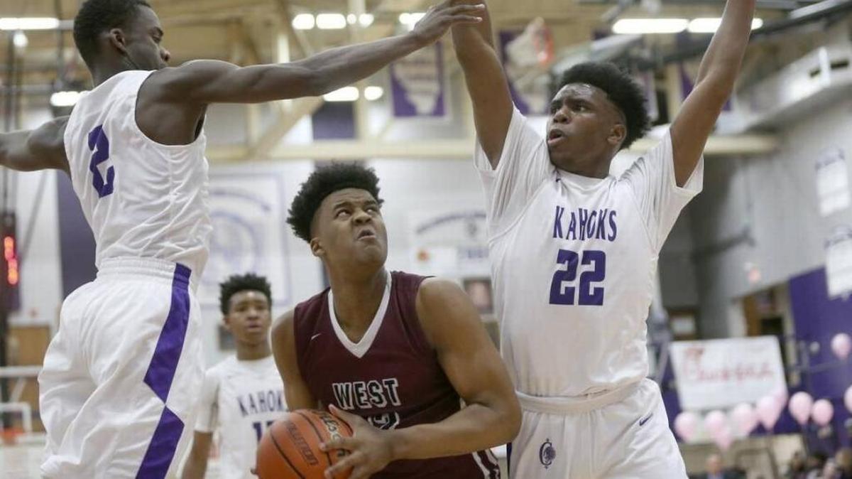 Belleville West's Keith Randolph works to get a shot off against Collinsville's Kenrique Brown and Austin Knight last year. Randolph transferred to West after playing his freshman season at Christian Brothers College High School in St. Louis.