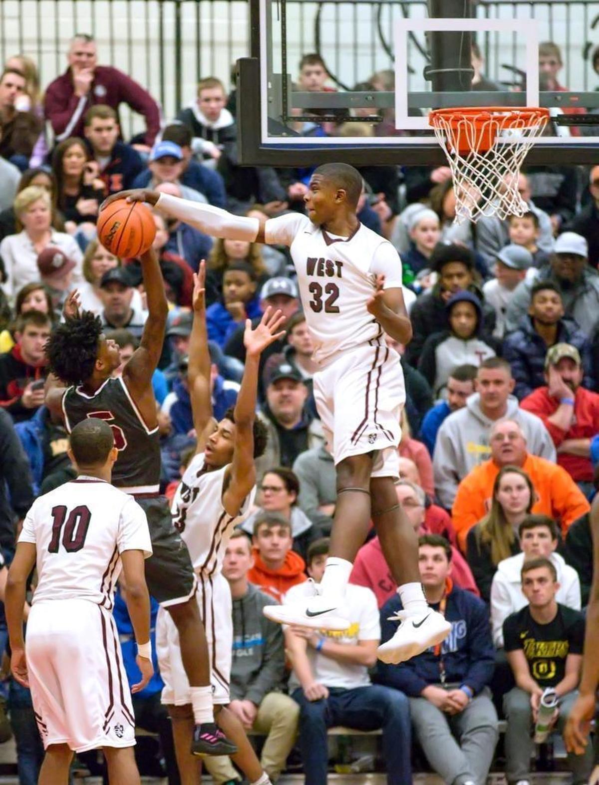 Belleville West’s EJ Liddell blocks a shot by Poplar Bluff’s Rodney Houston during the 27th annual Highland Shootout at Highland High School.