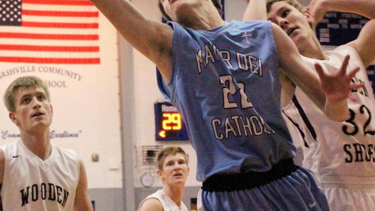 Mater Dei’s Garrett Boeckmann grabs a rebound from Teutopolis’ Chris Ungrund