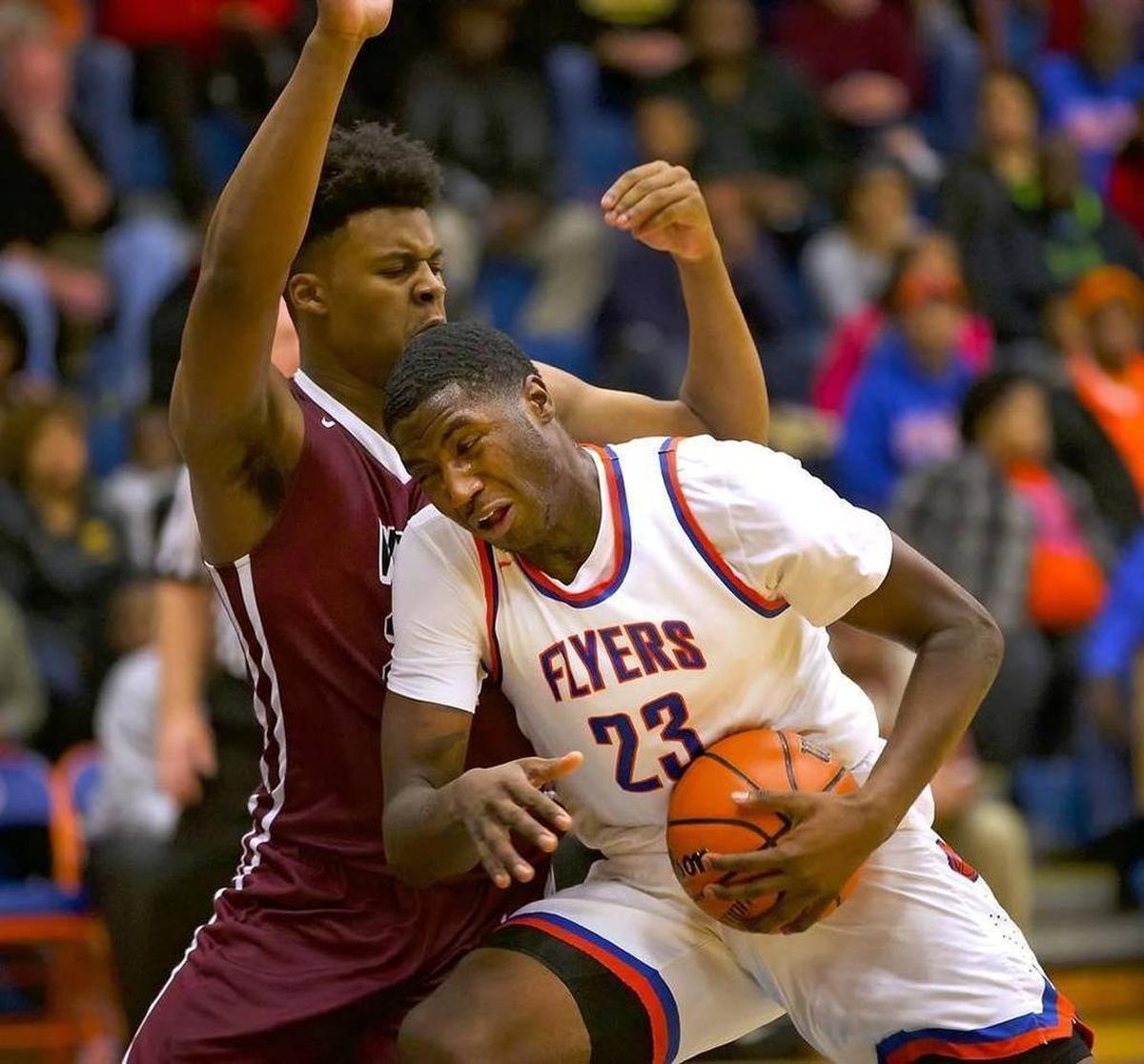 Jeremiah Tilmon, No. 23, charges for the basket during a Southwestern Conference game against Belleville West in December 2016. The 6-11 East St. Louis center, a consensus four-star recruit, signed to play college basketball at the University of Missouri, the school announced Monday.