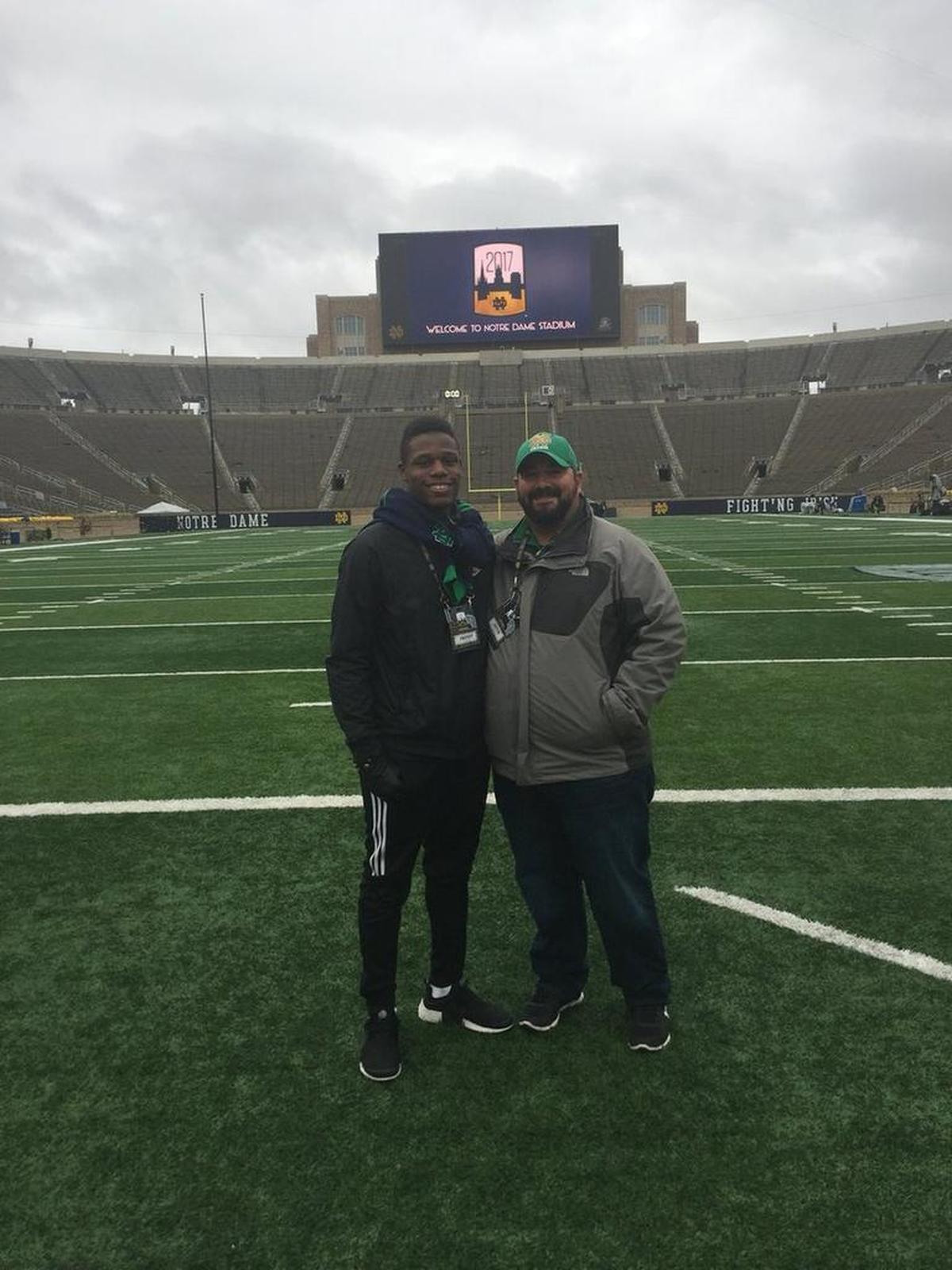 Freddy Edwards (left) with Granite City defensive line and special teams coach Justin Williamson in Notre Dame Stadium.
