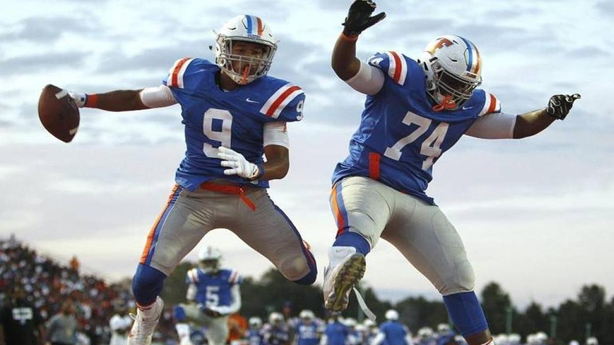 East St. Louis Flyers’ Eric Owens and Mckinnley Whitehead celebrate a score in last season’s Gateway Scholars Football Classic.