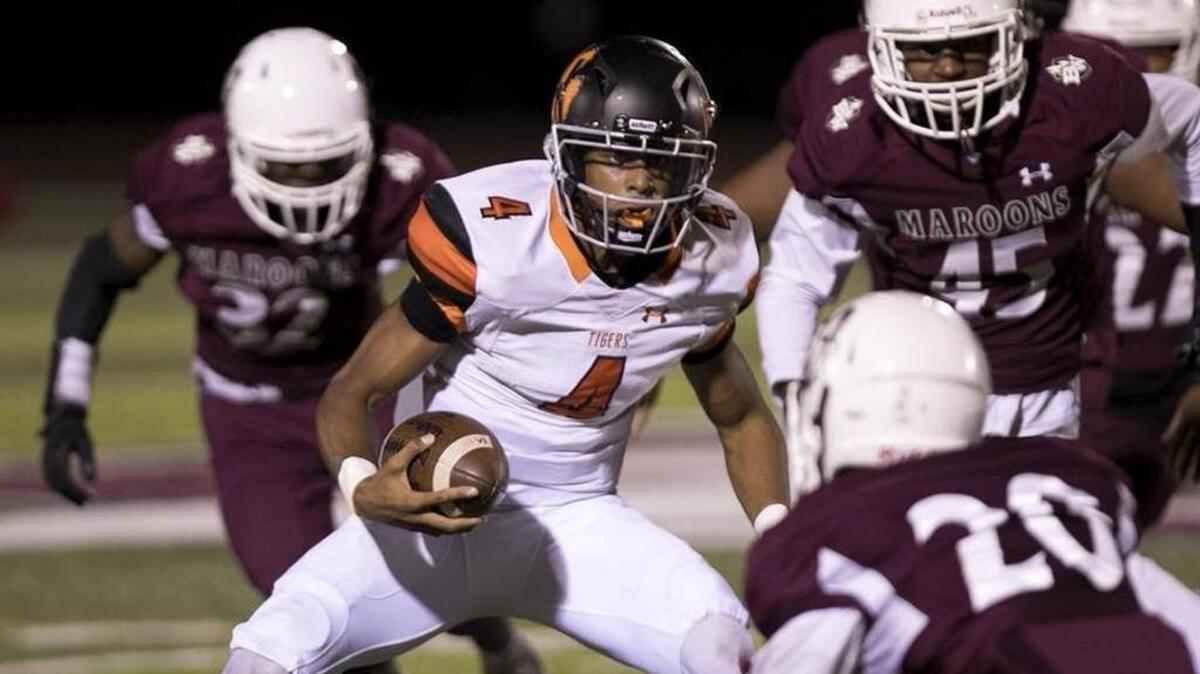 Edwardsville junior quarterback Kendall Abdur-Rahman (4) has powered the Tigers to six consecutive victories and a berth in the Class 8A playoffs. They will play at Huntley at 7 p.m. Friday.