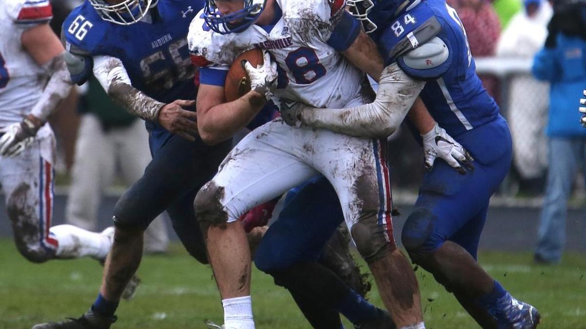 Nashville’s Ole Miss recruit Royce Newman is seen dragging two defenders along in the Class 2A semifinals last fall.