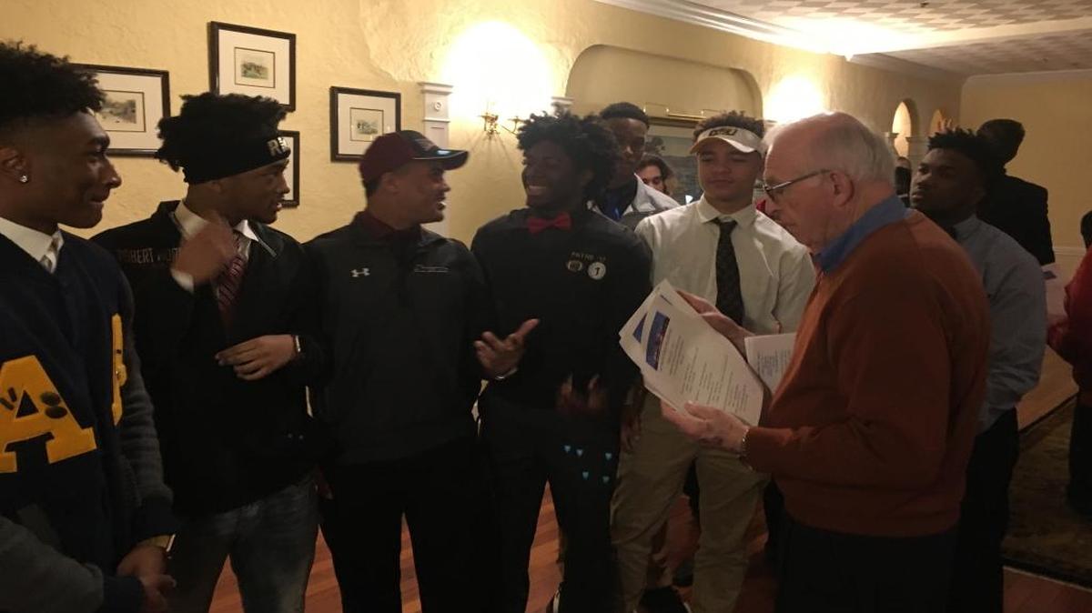 Some of the Althoff Crusaders football recruits get together before making their signing day announcements Wednesday at the National Football Foundation event at Norwood Hills Country Club in St. Louis.