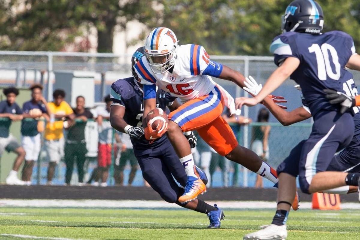 East St. Louis’ Lawaun Powell Jr. carries the ball during the Flyers’ game at Belleville East last year. He’ll be the primary target at wide receiver when East Side travels north to play Detroit King.
