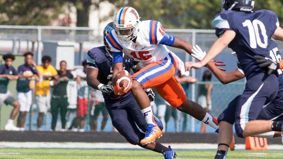 East St. Louis’ Lawaun Powell Jr. carries the ball during the Flyers’ game at Belleville East last year. He’ll be the primary target at wide receiver when East Side travels north to play Detroit King.