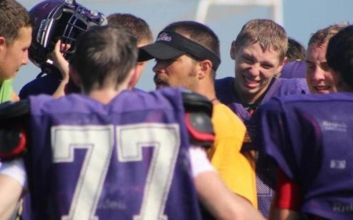 Carlyle coach Chris Birkner huddles with his players during practice.