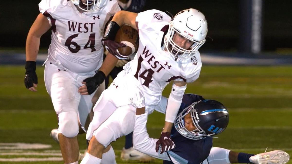 Belleville West’s Will Lanxon (14) runs the ball against rival East last season. The senior caught 49 passes as a junior, but he can also play at running back and quarterback.