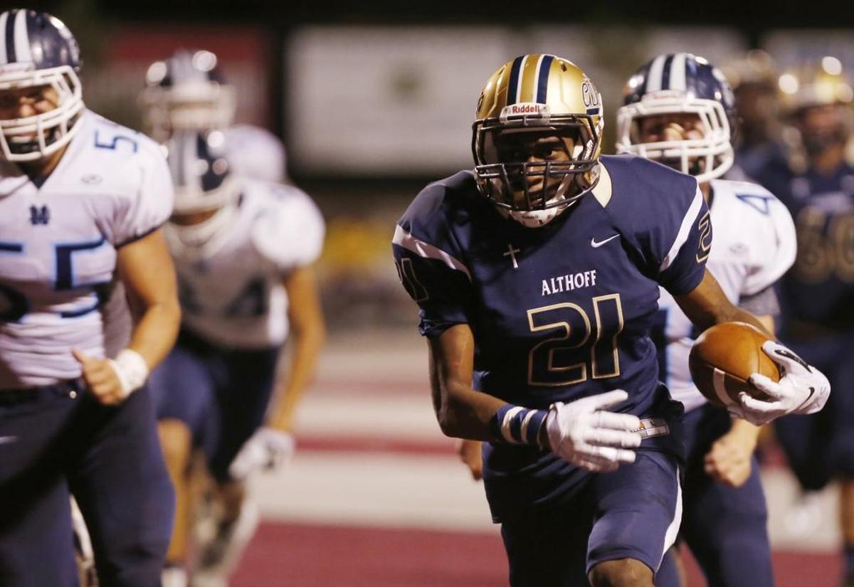 Althoff High graduate CJ Coldon carries the ball during a game in 2016. Coldon, who played the 2022 season at Oklahoma, now has his sights set on the NFL draft.