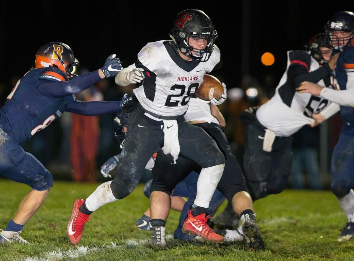 Highland’s Brady Feldmann carries the ball Saturday during a playoff game at Rochester High School.